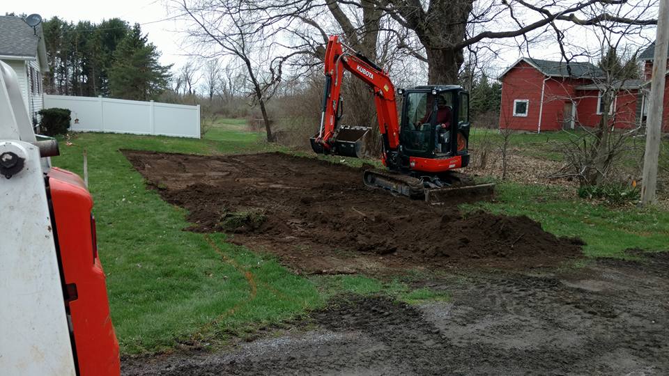 screened topsoil, premium topsoil, construction soil solutions, landscaping topsoil, drainage optimization, soil leveling services, nutrient-rich soil, Batavia NY topsoil, Albion NY topsoil, Pro Seal & Paving, quality screened topsoil, foundation soil, professional soil delivery, topsoil for construction, landscaping soil improvement