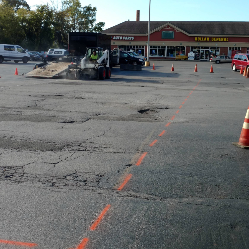 Parking Lot Repairs and Patching (1) commercial parking lot paving, parking lot resurfacing, asphalt parking lot installation, commercial asphalt paving, parking lot replacement, parking lot paving contractor, new parking lot construction