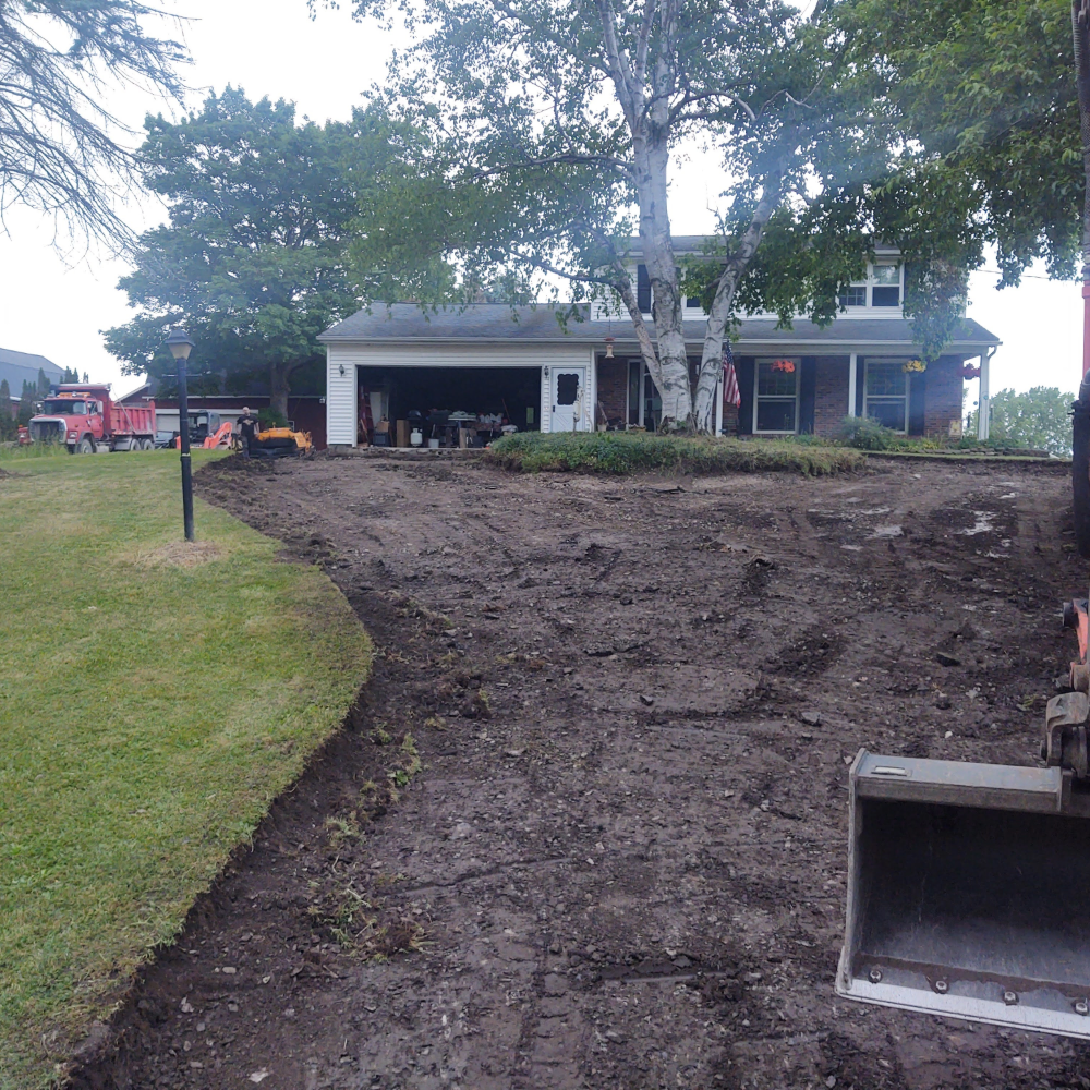 Residential Excavation and Grading https://prosealandpaving.com/wp-content/uploads/2026/01/Residential-Excavation-and-Grading.png